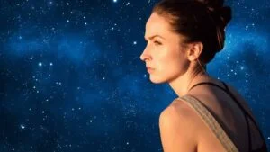 A broken hearted woman sitting outside alone